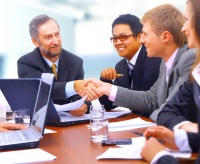 Business people shaking hands, finishing up a meeting Business people
