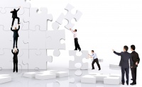 business team work building a puzzle isolated over a white background business team work